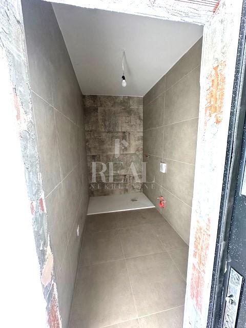 Centar Žminja,Novogradnja stan 54 m2 1S+DB,loggia,okućnica 100 m2